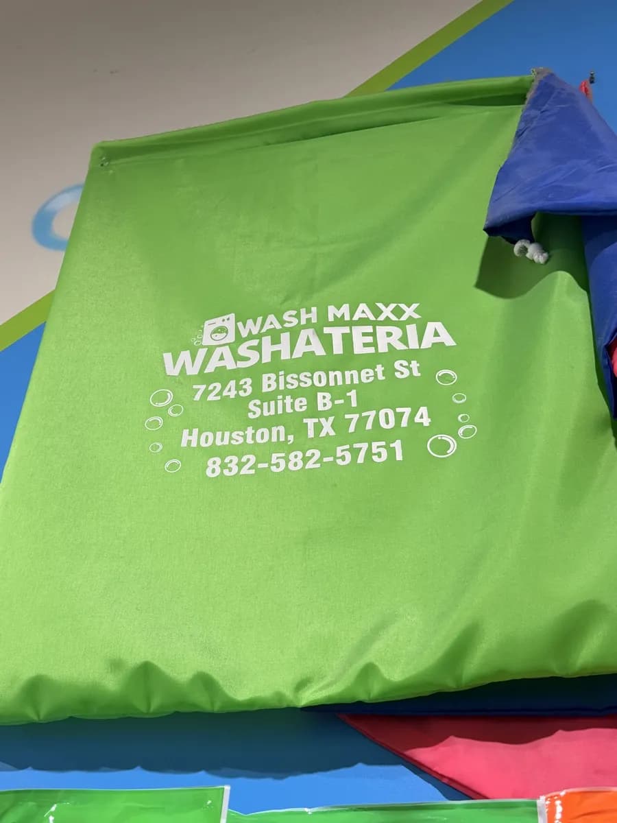 Bright green reusable WASH MAXX laundry bag